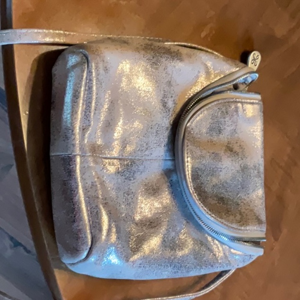 Fern Hobo cross body.Brushed Antique Brass Hardware. Metallic shine.